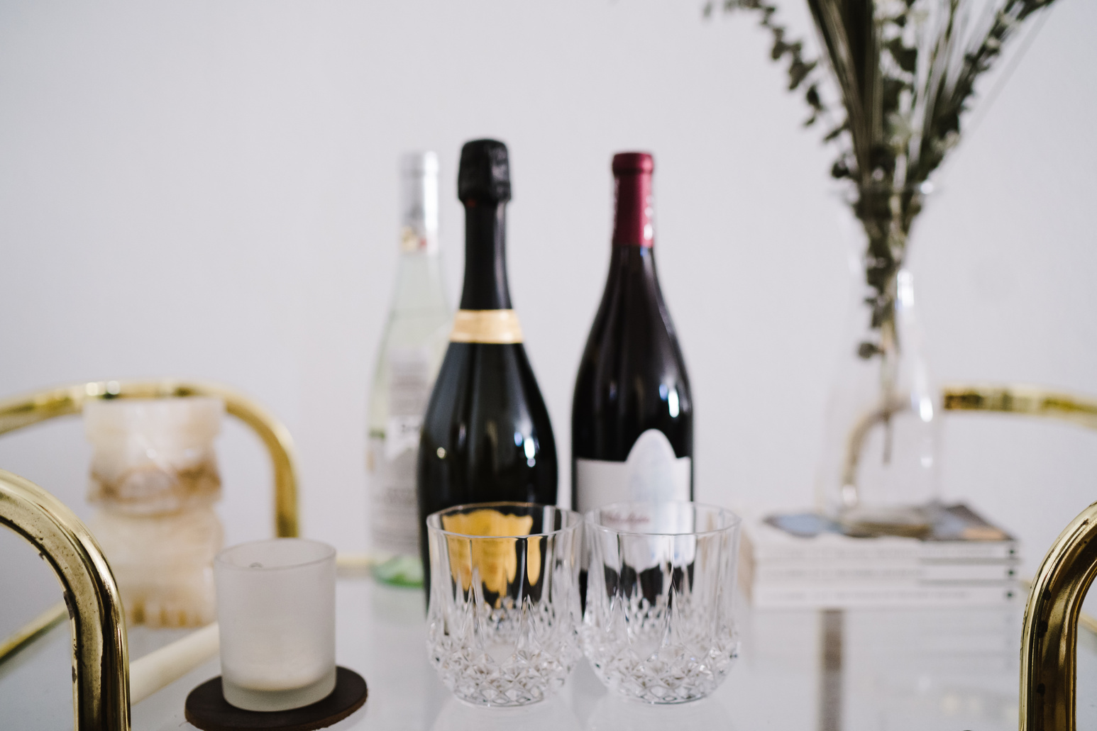 Wine Bottles and Glasses on a Bar Cart